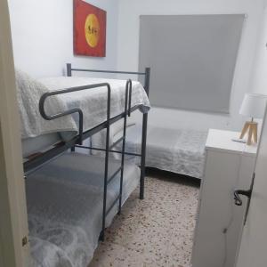 Posteľ alebo postele v izbe v ubytovaní Urbanización las Sirenas, 2 dormitorios