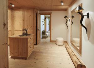 a bathroom with a sink and a mirror at Kempinski Hotel Das Tirol in Jochberg