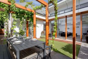 an outdoor dining area with a table and chairs at Norwood Haven- Pool - Pet Friendly & Free WiFi in Norwood