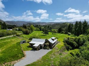 an aerial view of a house in a field at The Wee Glen - Peaceful Country Retreat in Bennetts