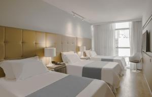 Katil atau katil-katil dalam bilik di Vivaldi Hotel Loft Punta Carretas