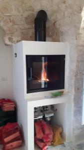 A television and/or entertainment centre at Trulli Spinosa