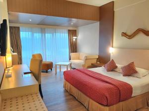 Postel nebo postele na pokoji v ubytování Lux Tychi Hotel