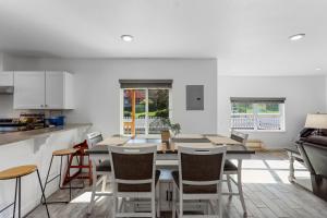 a kitchen and dining room with a table and chairs at The Gather House in The Dalles