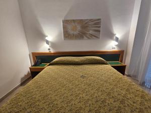 Postel nebo postele na pokoji v ubytování Hotel Neptunus