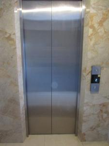 a stainless steel elevator in a building at Regner-Quinto Real Estate Services in Cebu City +7 photos