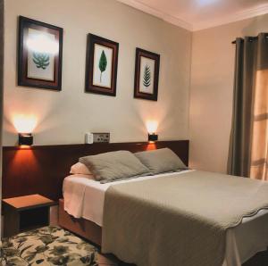 Postel nebo postele na pokoji v ubytování Hotel de Minas