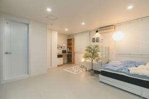 Ένα ή περισσότερα κρεβάτια σε δωμάτιο στο Venture Town Gukbin Seowon