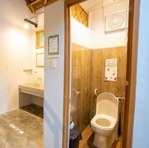 a bathroom with a toilet and a sink at New Private Rooms in Haole Santa Fe in General Luna
