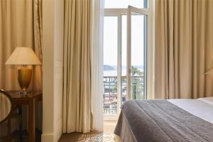 Letto o letti in una camera di Hotel Kempinski Palace Portorož