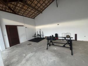 a room with a table in the middle of a room at Village Pedra do Sal Lounge Apts in Salvador