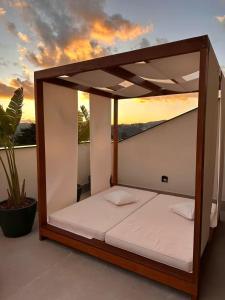 Giường trong phòng chung tại Wanderlust Experiencie Hotel