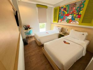 MaxoneHotels.com at Kramat tesisinde bir odada yatak veya yataklar