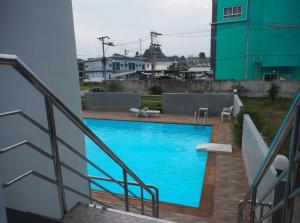 a swimming pool on the side of a building at The Ozone Krabi Condotel in Krabi