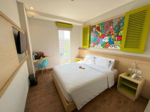 MaxoneHotels.com at Kramat tesisinde bir odada yatak veya yataklar