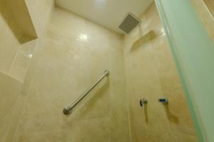 a shower with a metal handrail in a bathroom at Cartagena Beach Resort 1133 in Cartagena de Indias +9 photos