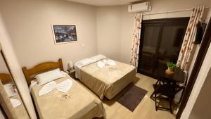 Posteľ alebo postele v izbe v ubytovaní Pousada Folhas de Outono