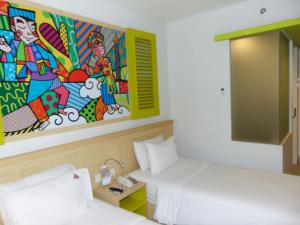 MaxoneHotels.com at Kramat tesisinde bir odada yatak veya yataklar