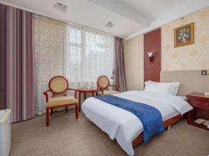 Postel nebo postele na pokoji v ubytování Weihai Huayu Business Hotel + 135 fotografií