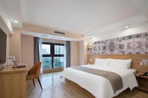 Ένα ή περισσότερα κρεβάτια σε δωμάτιο στο PAI Hotels·Jiangbei Airport Central Park