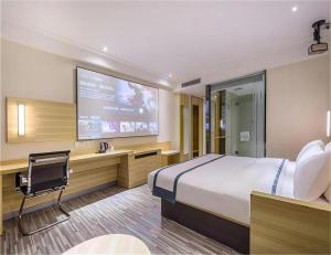 Ένα ή περισσότερα κρεβάτια σε δωμάτιο στο City Comfort Inn Hankou Railway Station Tangjiadun Wanda Plaza +240 φωτογραφίες