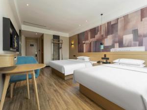 Ένα ή περισσότερα κρεβάτια σε δωμάτιο στο City Comfort Inn Suizhou Bingzi Wanda +146 φωτογραφίες