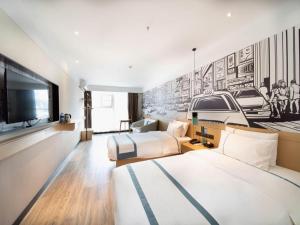 TV a/nebo společenská místnost v ubytování City Comfort Inn Zhongshan Banfu