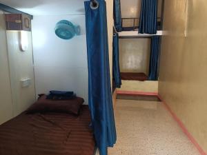 Postel nebo postele na pokoji v ubytování Blue Zone Hostel