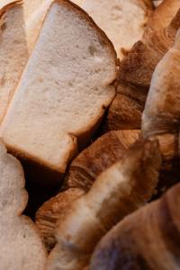 a close up of bread and other food items at Hotel She, Osaka in Osaka