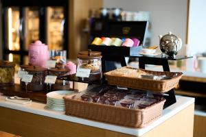 a display of chocolates and other desserts on a counter at Cerulean Tower Tokyu Hotel, A Pan Pacific Partner Hotel in Tokyo