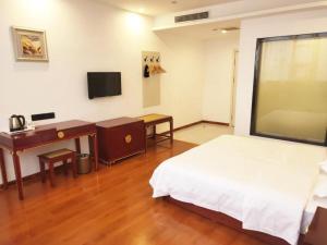 TV a/nebo společenská místnost v ubytování Shell Hotel Liaocheng Dongchang Xi Road Railway Station + 29 fotografií