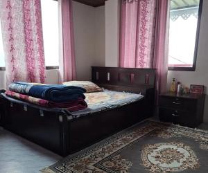 Postel nebo postele na pokoji v ubytování Dumfu Homestay