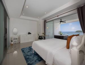 Voodi või voodid majutusasutuse Exclusive 3BR Oceanview Kata Penthouse - Pasifora toas