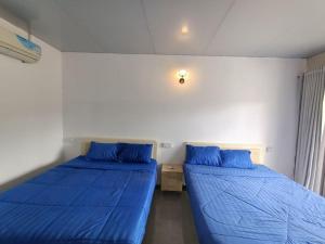 Postel nebo postele na pokoji v ubytování Blue Zone Hostel