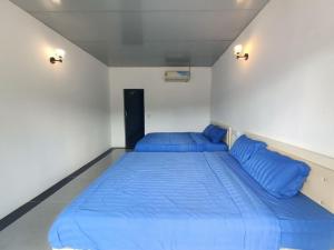 Postel nebo postele na pokoji v ubytování Blue Zone Hostel