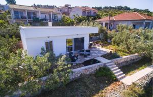 an aerial view of a house with a stone wall at Beautiful Home In Necujam With Wifi in Nečujam +13 photos