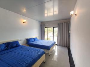 Postel nebo postele na pokoji v ubytování Blue Zone Hostel