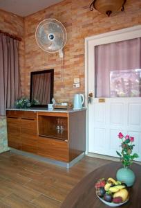 TV a/nebo společenská místnost v ubytování Palm Sweet Hotel