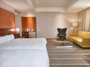 Rúm í herbergi á Via Hotel Breeze
