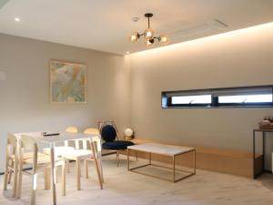 a dining room with a table and chairs at Changwon Brown dot Hotel Palyong in Changwon