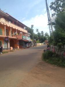 an empty street in a town with a building at Home stay in Varkala