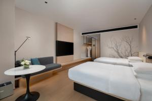 Postel nebo postele na pokoji v ubytování Fairfield by Marriott Yiwu