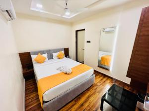Letto o letti in una camera di Shankar Bhavan By Vinayak Hotels