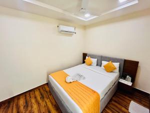 Letto o letti in una camera di Shankar Bhavan By Vinayak Hotels