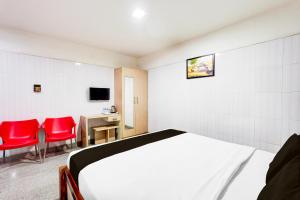 TV a/nebo společenská místnost v ubytování Super Hotel O Arcot Road Porur + 24 fotografií