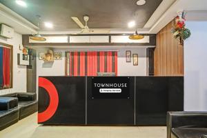 a view of a room with a townhouse sign on a wall at Super Townhouse Zoo Road Near Guwahati Central Formerly IR Luxuria in Guwahati
