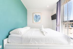 Ένα ή περισσότερα κρεβάτια σε δωμάτιο στο Sleek 2 Bed Apt T2-818 +7 φωτογραφίες