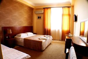 Letto o letti in una camera di Hotel Condori