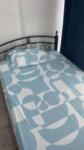 a blue and white bed in a room at Whole Ocean View Manila Bay 4 Bedrooms in Manila +25 photos