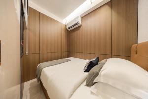 Postel nebo postele na pokoji v ubytování Xi Ke Executive Apartment - Shenzhen Futian Exhibition Center